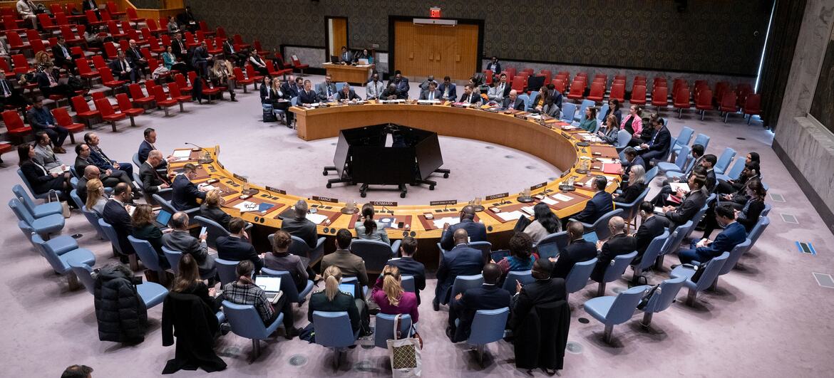 A wide shot of the United Nations Security Council chamber during a meeting on Kosovo and the UN Interim Administration Mission in Kosovo (UNMIK). Delegates are seated around the iconic horseshoe table.