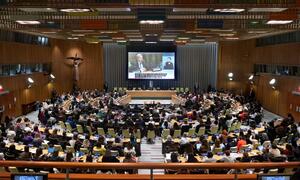 Wide view of a townhall meeting with the UN Secretary-General and civil society participants at the 70th session of the Commission on the Status of Women (CSW). A large audience is seated in a modern conference hall, with a large screen displaying the event.