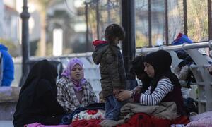 Displaced people, including women and children, sleep on blankets on the ground in the coastal area of Ain El Mreisseh in Beirut, Lebanon, on March 11, 2026.