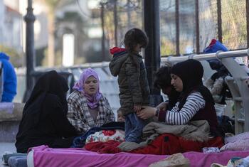 Displaced people, including women and children, sleep on blankets on the ground in the coastal area of Ain El Mreisseh in Beirut, Lebanon, on March 11, 2026.