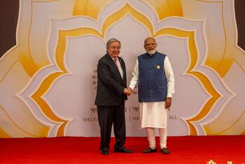 UN Secretary-General António Guterres shakes hands with Indian Prime Minister Narendra Modi at the India AI Impact Summit in New Delhi, February 2026.