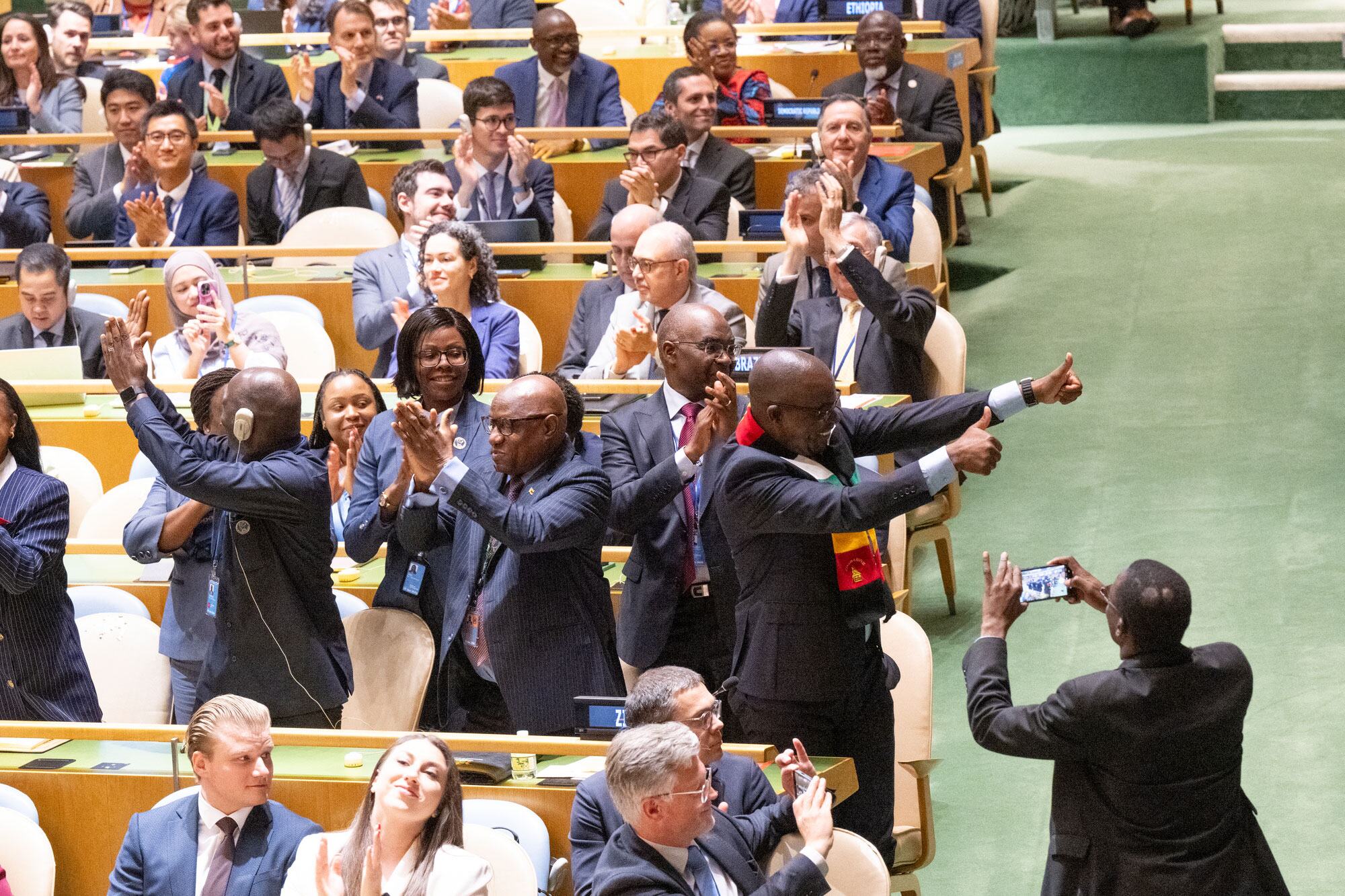 Delegates from Zimbabwe celebrate their election as a non-permanent member of the UN Security Council.