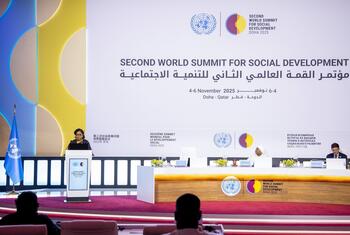 A woman speaks at a podium during the Second World Summit for Social Development plenary session in Doha, Qatar, in November 2025.