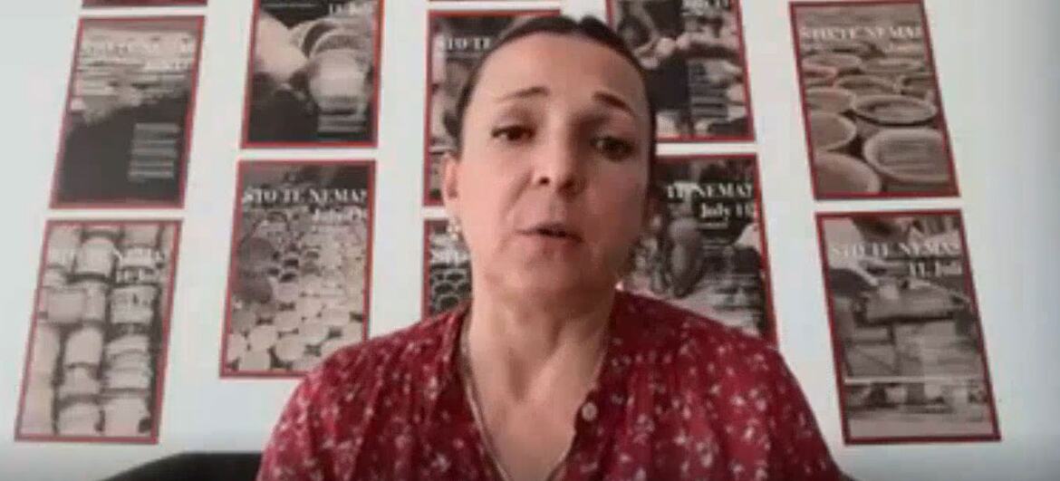 Aida Sehovic speaks during a live discussion about engaging with difficult histories. Posters for the Juneteenth event are displayed on the wall behind her.