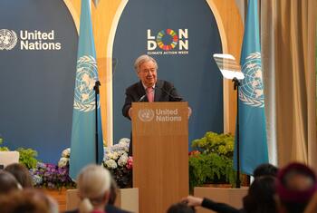 UN Secretary-General António Guterres speaks at a podium during a Climate Action Week event in London.