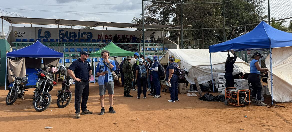 Emergency response personnel and relief workers gathered at a temporary aid station in La Guaira, Venezuela, following an earthquake.