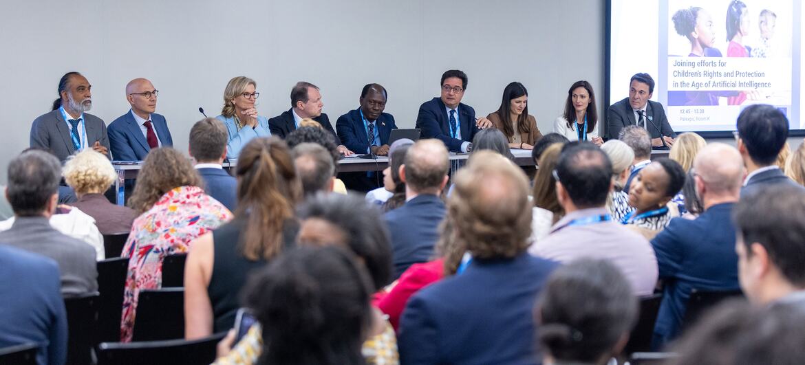 A panel of diverse participants discusses children's rights and AI governance at the ITU Global Dialogue in Geneva, with an audience in attendance.