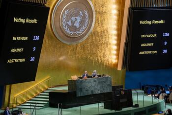 Voting results are displayed on large screens at the UN General Assembly during a vote on the US embargo against Cuba.