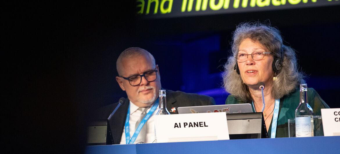 Sonia Livingstone speaks at the Global Dialogue on AI Governance panel at Palexpo in Geneva. A male panelist is seated beside her.
