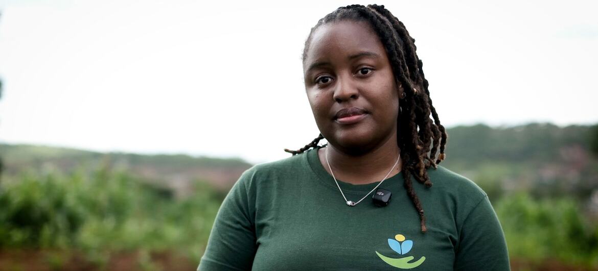 Portrait of a Black woman wearing a green t-shirt with the Ndinewe Foundation logo, standing outdoors in Zimbabwe.