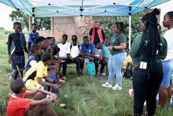 Ndinewe Foundation staff and youth participants in an outdoor community session in Zimbabwe.