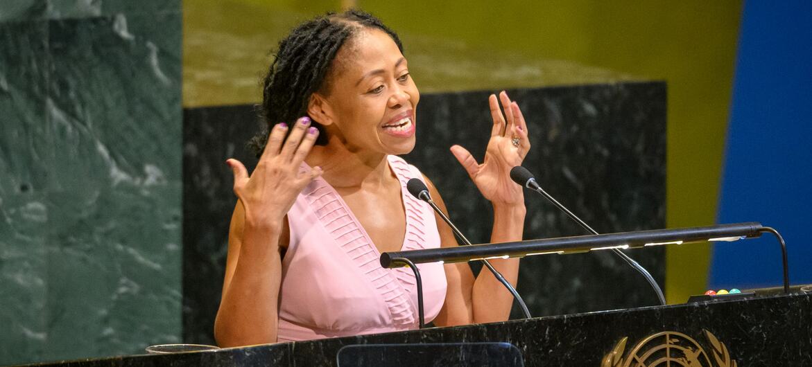 South African journalist Redi Tlhabi speaks at a podium during a UN General Assembly session for Nelson Mandela International Day.
