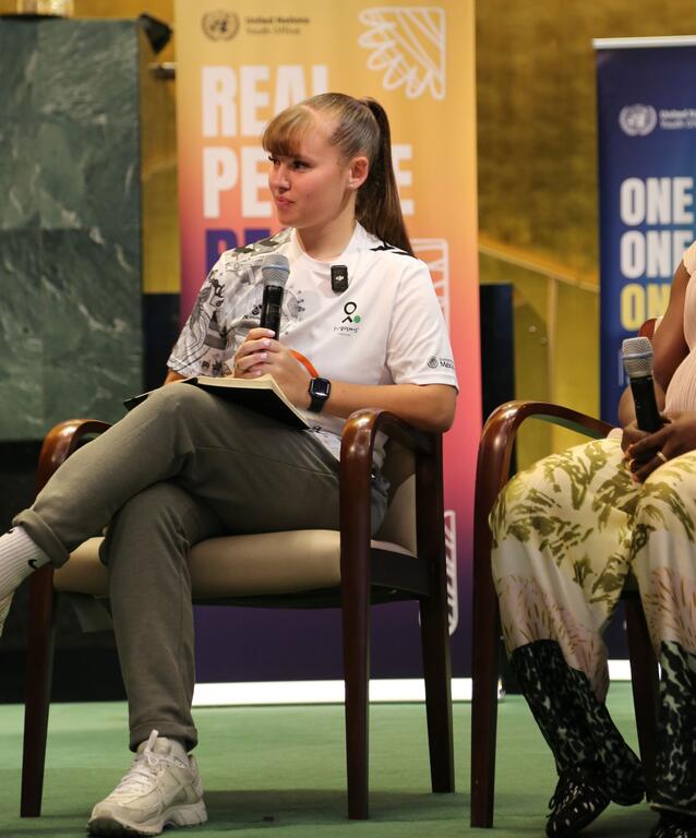 A young woman from Street Child United speaks at a UN Youth Office event on Football and Mental Health.