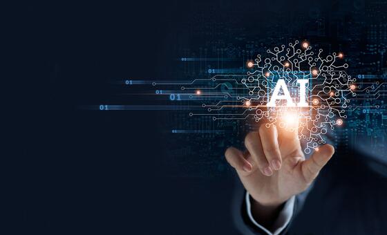 A hand in a suit sleeve reaches toward a glowing AI symbol composed of connected nodes, circuitry, and binary digits on a dark blue technological background.