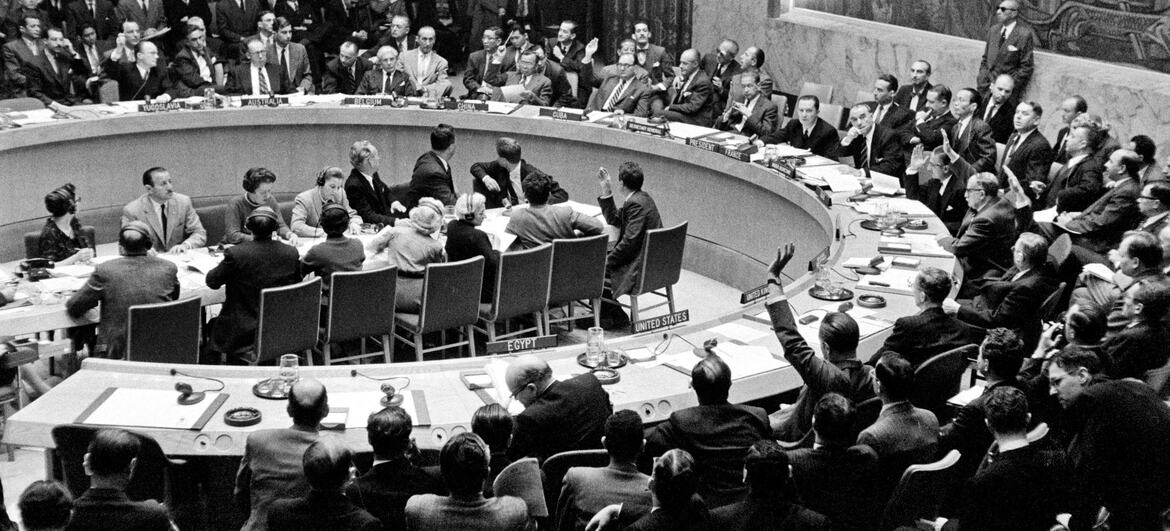 UN Security Council delegates vote in the council chamber during a session calling an emergency special General Assembly meeting over the Middle East crisis.