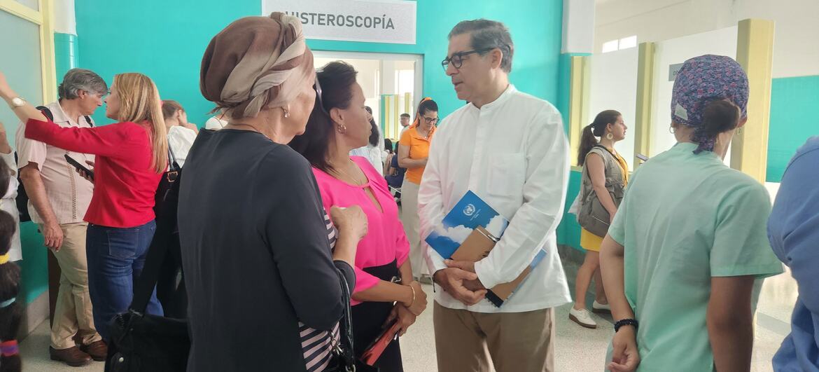 United Nations Resident Coordinator Francisco Pichon visiting a healthcare facility in Cuba, engaging with local staff and visitors.