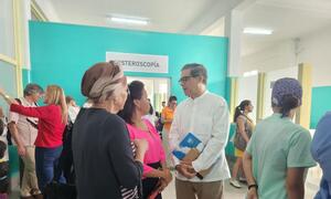 United Nations Resident Coordinator Francisco Pichon visiting a healthcare facility in Cuba, engaging with local staff and visitors.