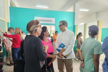 United Nations Resident Coordinator Francisco Pichon visiting a healthcare facility in Cuba, engaging with local staff and visitors.