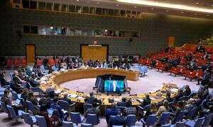 Wide view of the United Nations Security Council meeting discussing the situation in Haiti, with delegates seated around a large circular table.