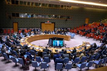 Wide view of the United Nations Security Council meeting discussing the situation in Haiti, with delegates seated around a large circular table.