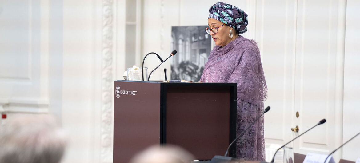 Amina Mohammed, UN Deputy Secretary-General, delivering a speech at Folketinget in Denmark, advocating for global peace, sustainable development, and protection of the UN Charter.