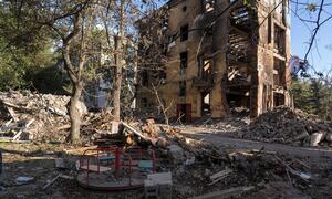 Ruins of a residential building destroyed by shelling stand next to a children's playground in Druzhkivka, Donetsk region, Ukraine. Debris, collapsed walls and twisted metal dominate the area, a stark reminder of the risks families face in frontline communities of eastern Ukraine.
