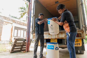 RMSD officers in Angoda, Sri Lanka, accepting a UNICEF donation of calcium hypochlorite barrels on December 2, 2025, as part of the flood-response supply process.