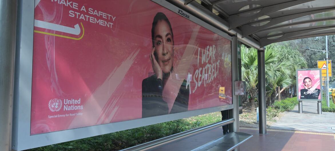 UN Road Safety Campaign Poster at a Bus Stop in India.