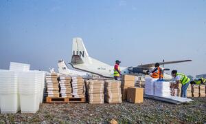 MINUSCA personnel prepare electoral supplies, including boxes and plastic weather proof containers, for transport onboard mission aircrafts as the Central African Republic heads to polls on 28 December 2025.