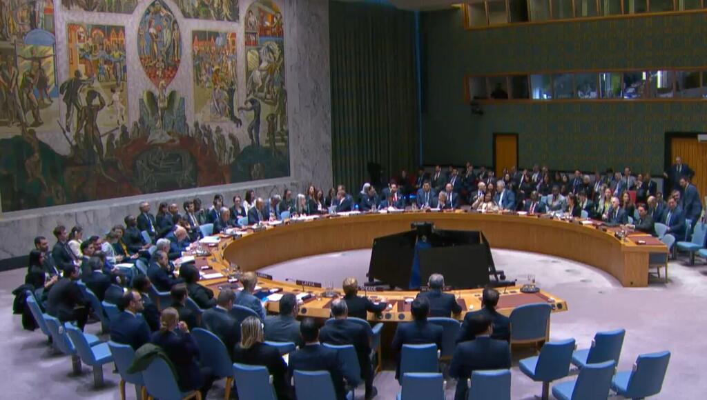 Diplomats gather at the UN Security Council to discuss the fast-evolving crisis in Iran and the whole Middle East region. A diplomatic meeting at the United Nations Security Council with delegates seated around a large circular table.