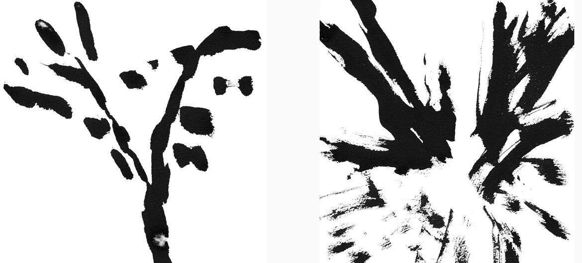 Two abstract black and white ink paintings by Sandy Walker. The left painting shows a vertical, tree-like form with sparse branches. The right painting features a dynamic, radiating burst of thick, expressive brushstrokes.