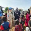 UN Woman Police Officer of the Year, Inspector Stephanie Königs from Germany, engages with a local community in a refugee camp in South Sudan.
