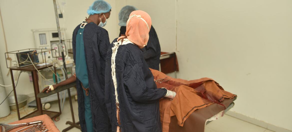 Doctors perform a cesarean section at El Obeid Maternity Hospital in Sudan. The hospital faces equipment shortages, with only 4 of 7 operating rooms functional and limited anesthesia capacity, leading to maternal deaths.
