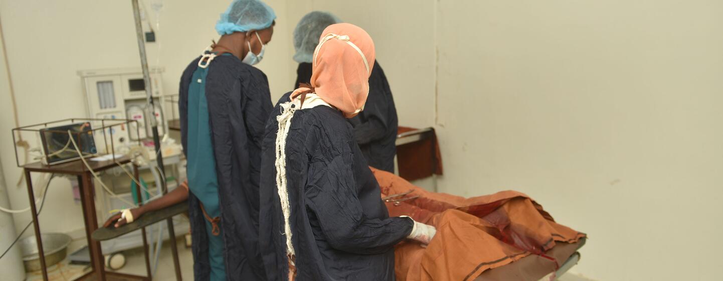 Doctors perform a cesarean section at El Obeid Maternity Hospital in Sudan. The hospital faces equipment shortages, with only 4 of 7 operating rooms functional and limited anesthesia capacity, leading to maternal deaths.