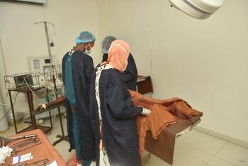 Doctors perform a cesarean section at El Obeid Maternity Hospital in Sudan. The hospital faces equipment shortages, with only 4 of 7 operating rooms functional and limited anesthesia capacity, leading to maternal deaths.