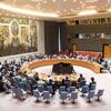 Des délégués assis autour de la table ronde lors d'une réunion du Conseil de sécurité de l'ONU à New York.