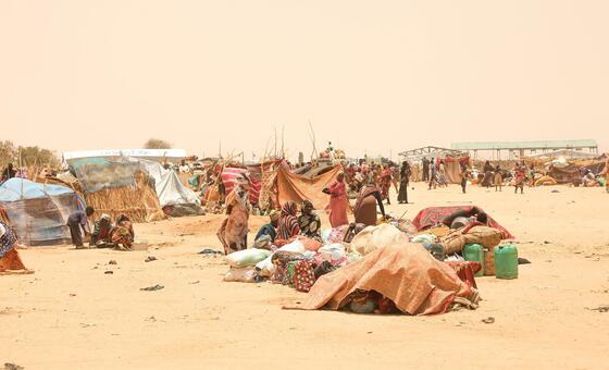 Sudanese refugees displaced by conflict gather at a relocation site in Tiné, eastern Chad,