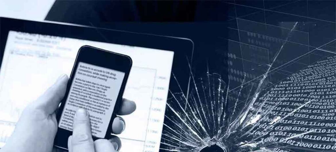 Mãos segurando um smartphone e um tablet ao lado de uma tela rachada com sobreposição de código binário, simbolizando cibercrime e ameaças à segurança digital.
