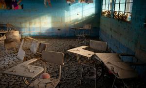 A classroom is filled with mud after a river overflowed during storms Eta and Iota in El Tenedor, Guatemala.