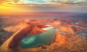 Water collects after rainfall in the desert of Oman.