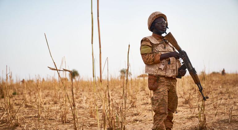 A soldier from Burkina Faso stands guard along the border with Mali and Niger during a military operation against terrorist suspects. 