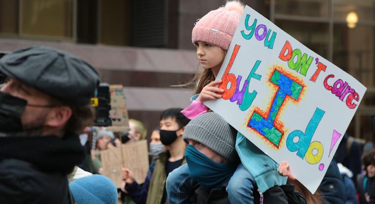 A young girl takes part in a climate change protest organized by Fridays for Future.