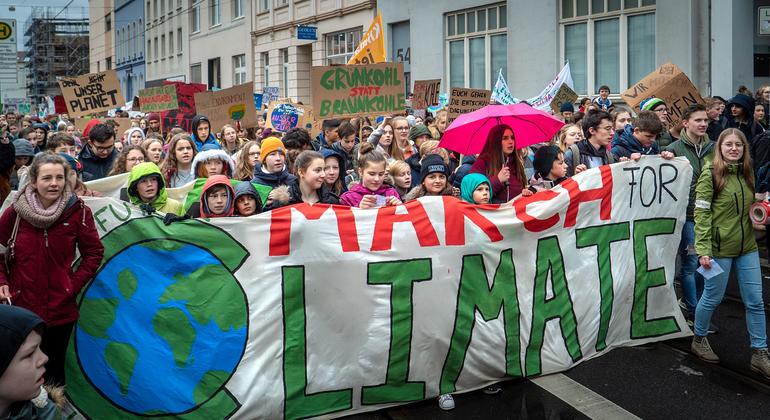  People take part in a Fridays for Future demonstration for climate action in Bonn, Germany.