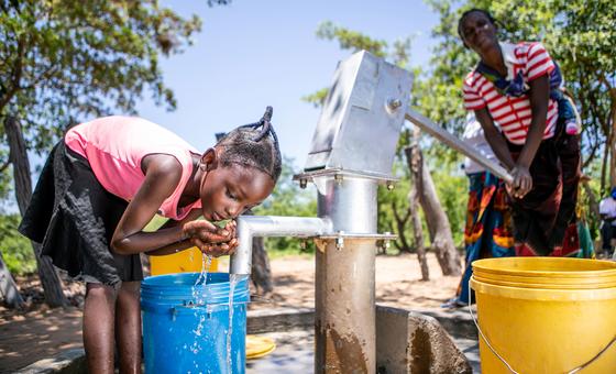 A young girl collects water from a recently rehabiliatitaed well in Gwembe Valley, Zambia