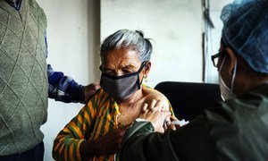 An elderly woman receives a COVID-19 vaccine at Paropakar Maternity and Women’s Hospital in Kathmandu, Nepal.