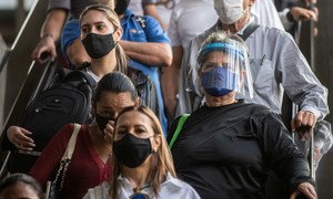 People wear face masks in Medellin, Colombia, to prevent the spread of COVID-19.