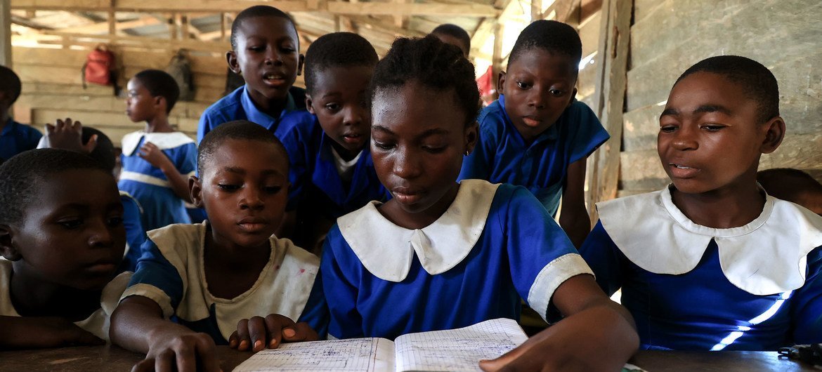 Displaced children attend class at a school in Cameroon.