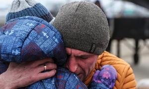 A father says goodbye to his son and his family after taking them to safety and then returning to Ukraine.