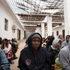 Migrants from Nigeria who were rescued by the Libyan Coast Guard as their boat was capsizing, crouch in a courtyard at a detention centre, where they are being held, in Libya. (file)
