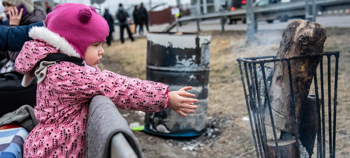 Families fleeing the escalating conflict in Ukraine arrive in Berdyszcze, Poland.